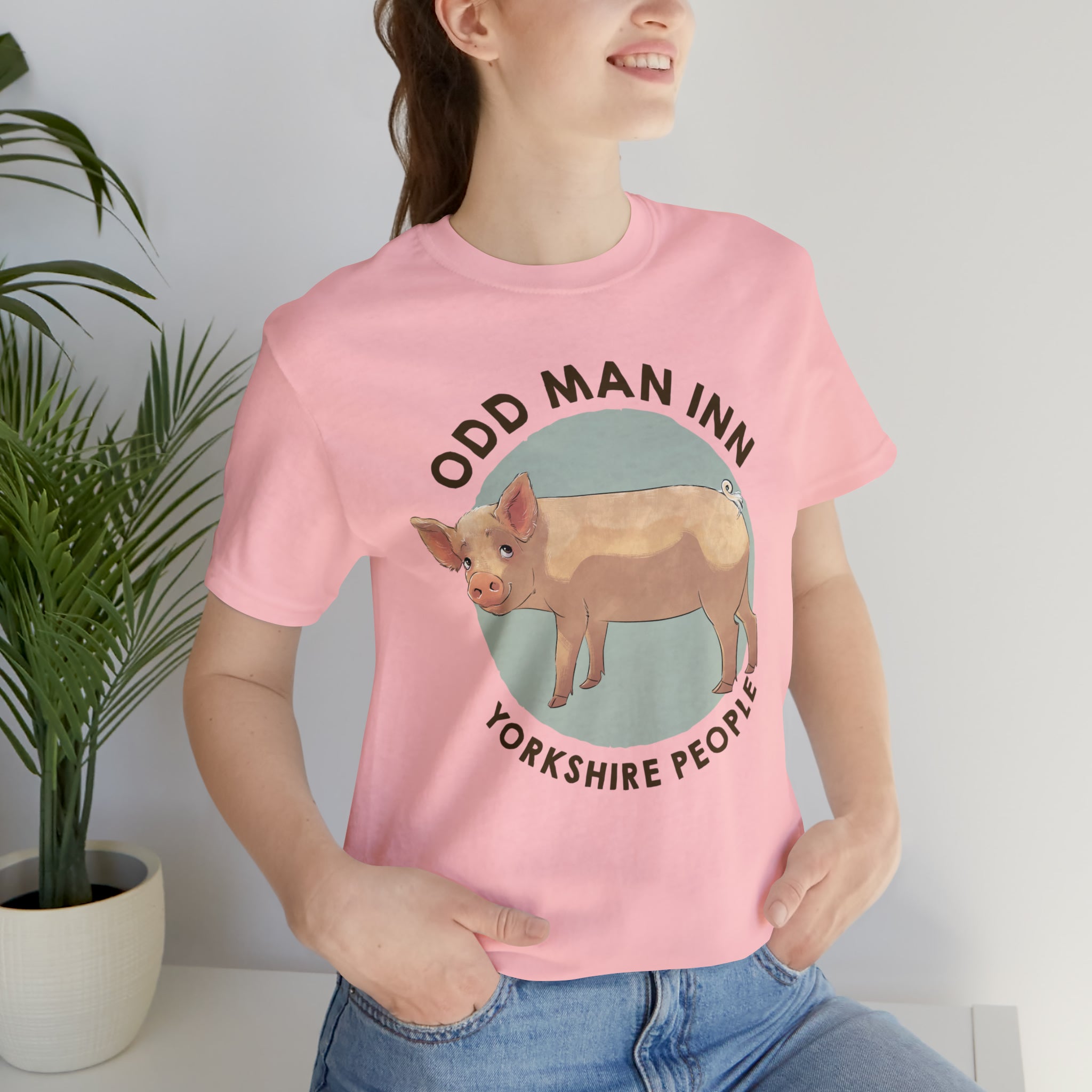 Model wearing an Odd Man Inn Yorkshire People T-shirt featuring an illustrated pig.